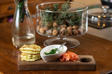 cauliflower pancakes with sour cream sauce and salmon