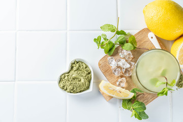 Green matcha lemonade on white background, copy space