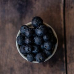 Blueberries' bowl on a wooden table