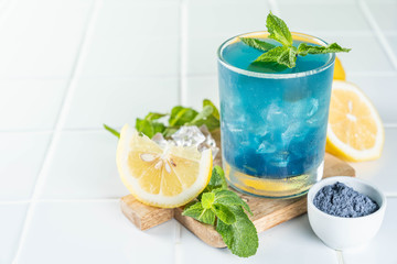 Blue matcha lemonade on white background, copy space