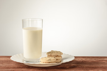 fresh healthy milk and cookies on a plate