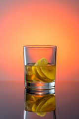 glass with a cocktail on a glossy surface