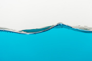 Wave of blue water on a white background.