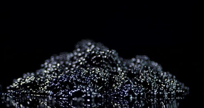 A pile of caviar on the table slowly rotates.