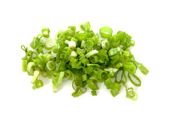 Pile of fresh chopped spring onion over white background