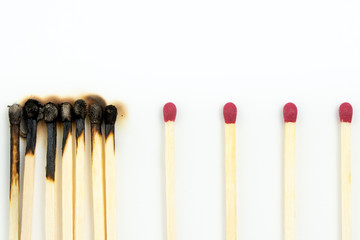 Social distancing concept using burnt out match sticks isolated on white background, prevent corona virus outbreak