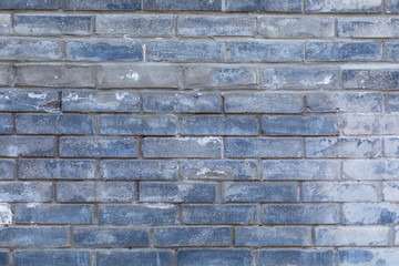 The background of a multicolor gradient painted brick wall of uneven fascia. Difference of color. Blue and brown shade of paint