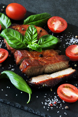 Meat steak with basil and cherry tomatoes. Paleo. Pegan. Keto diet.