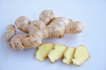 Organic fresh ginger root on white background with blue light tone