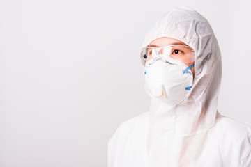 Portrait and closeup Asian female woman doctor or nurse in PPE uniform and gloves wearing face mask protective in laboratory holding, Health medical coronavirus or COVID-19 concept