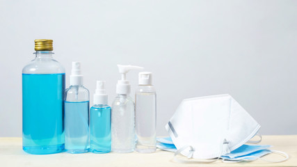 Bottle of hand sanitizer alcohol gel clear liquid plastic pump. antiseptic and mask prevent the spread of germ and bacteria antibacterial hygiene and avoid infection corona virus, covid 19 protection.