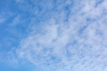 White clouds on a blue sky as background