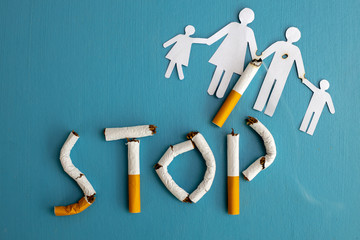 Paper cut of family destroyed by cigarettes. Drugs destroying family concept. Quit smoking for life on World no Tobacco day concept. World no tobacco day.advertisers.