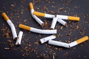 Broken cigarettes on black background , World No Tobacco Day concept