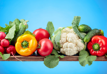 Various fresh raw vegetables, frontal view.