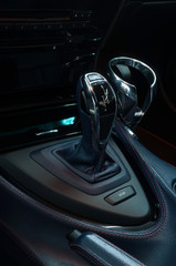 Fototapeta na wymiar Automatic car transmission. Interior detail. Vertical photo.