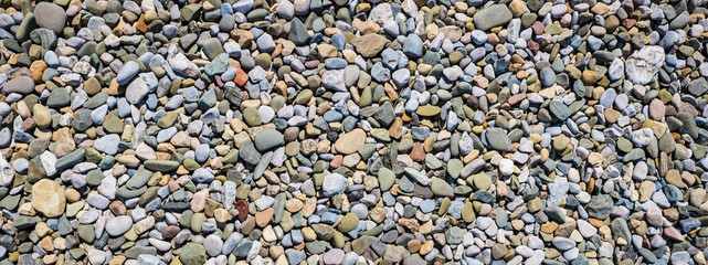 Panorama of pebble sea stones background Morecambe UK
