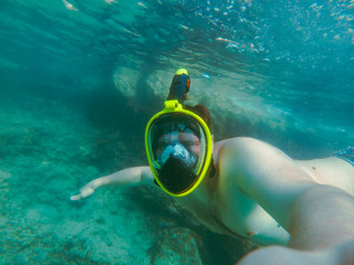 man with snorkeling mask underwater summer sea vacation
