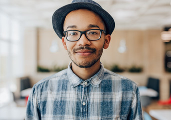 Ethnic guy resting in cafe