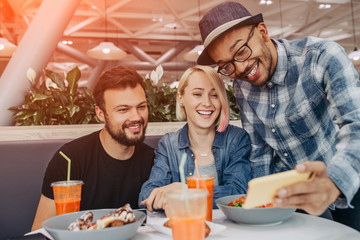 Ethnic man sharing video with friends