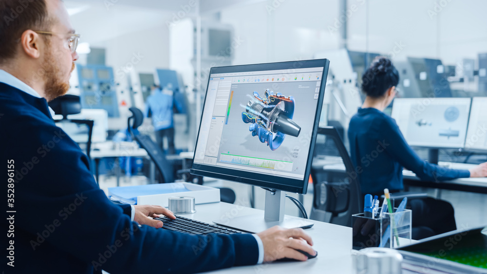 Leinwandbilder over shoulder: heavy industry engineer working on personal computer, screen shows cad software showi
