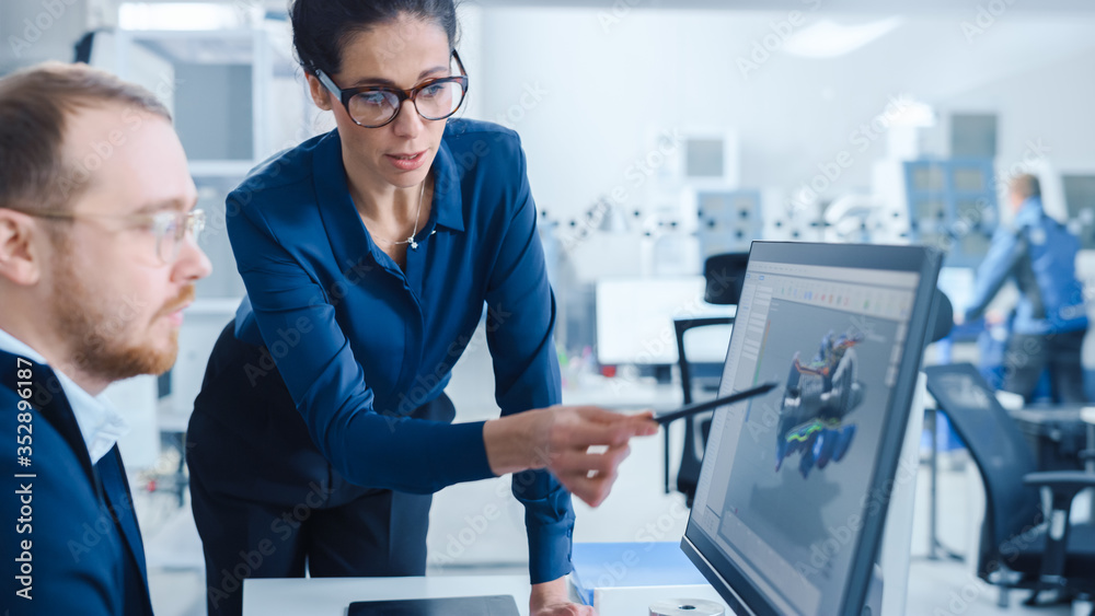 Poster Modern Factory: Female Project Supervisor Talks to a Male Industrial Engineer who Works on Personal Computer. They use CAD Software for Design and Development of Zero-Emissions Engine Prototype