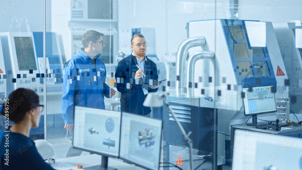 Poster Modern Factory: Chief Industrial Engineer Walks with Workshop Supervisor, They Use Tablet Computer and Discuss Project Details. Manufacturing Facility with CNC Machinery and Robot Arm Assembly Line
