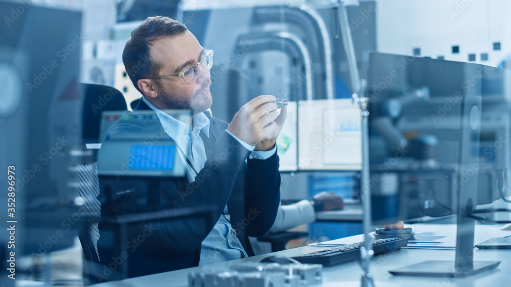 Poster electronics factory: male electrical engineer holds pcb prototype, works on personal computer, devel