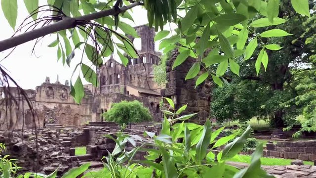 Kirkstall Abbey Monestry shot through a tree branch in Leeds, UK.