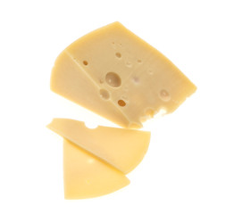 A piece of cheese, fresh and fragrant. There are many holes. Isolated on a white background.