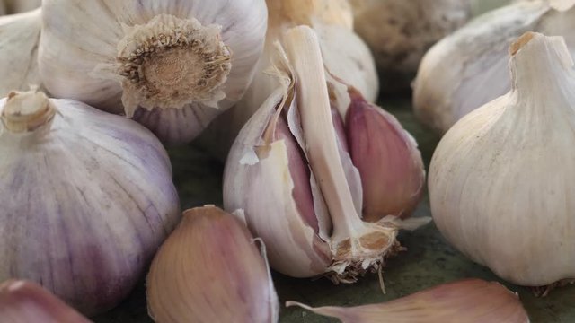 Rustic juicy eco garlic clove or garlic bulb on vintage wooden background. Concept of healthy food background. Shopping food supermarket