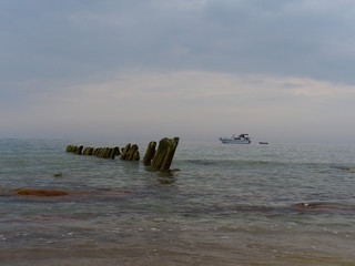 ship on the background of an old breakwater