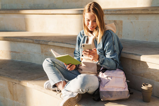 Beautiful young blonde woman wearing denim jacket - Powered by Adobe