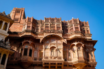 Beautiful details carved facade wall and windows exterior architecture in Mehrangarh fort at...