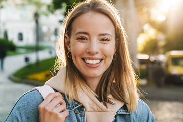 Beautiful young blonde woman wearing denim jacket