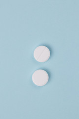 pills background, tablets on a blue background