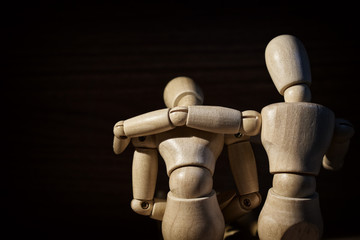 Wooden mannequin, Concern and worry of friend. Mental health, PTSD and suicide prevention. Post-traumatic stress disorder.