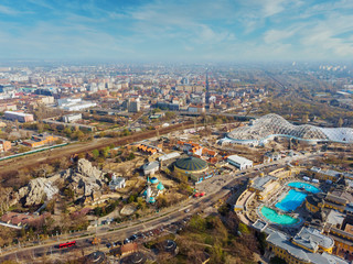 Beautiful top view of the zoo, Szechenyi baths, a mosque in Budapest. Top view of the railway, houses and city park. Spring. Blue sky and beautiful clouds in the background.