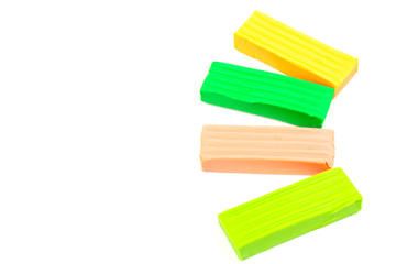 Group of colorful plasticine isolated on white background