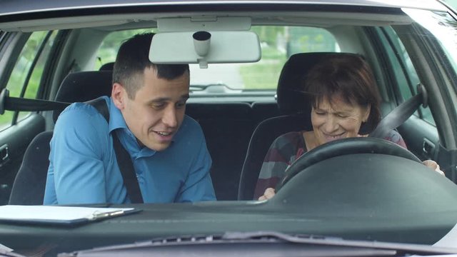 Angry driving instructor yelling at student