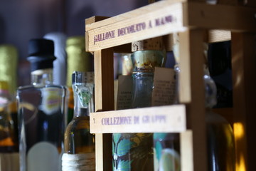 Old fashioned liquor glass bottles closeup