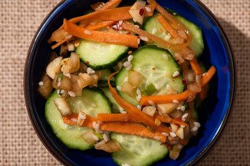 top view of pickled cucumbers with carrot and sesame