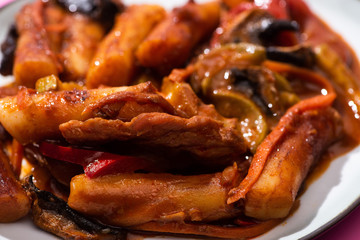 close up of delicious and spicy korean topokki in plate