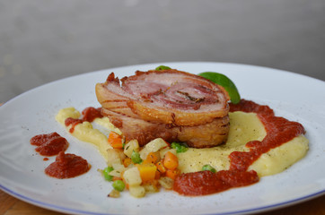 Traditional Holland style Roll pork belly with mashed potatoes and mixed vegetables.