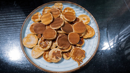 Traditional Dutch Mini Pancakes without any other ingredients with the black background