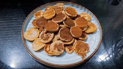 Traditional Dutch Mini Pancakes without any other ingredients with the black background