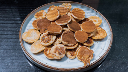 Traditional Dutch Mini Pancakes without any other ingredients with the black background