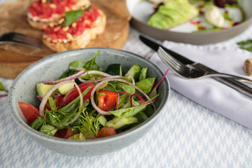 Fresh healthy vegetable salad on table