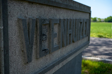 Vintage road sign welcoming you into the small prison town of Veenhuizen in Drenthe, the Netherlands.
