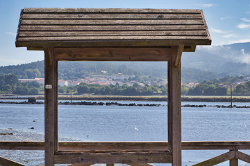 Sea framed by a wooden window
